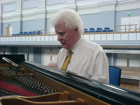 Phil preparing a Steinway grand piano at Birmingham Town Hall