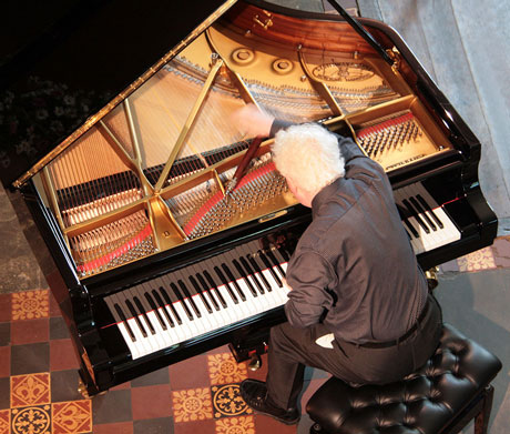 Philip Kennedy tuning a piano for the Hay Festival